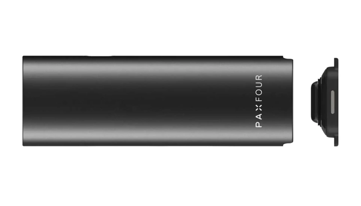 PAX Four vaporizer held in one hand, showing its slim matte body, compact size, and LED petal indicator on the front
